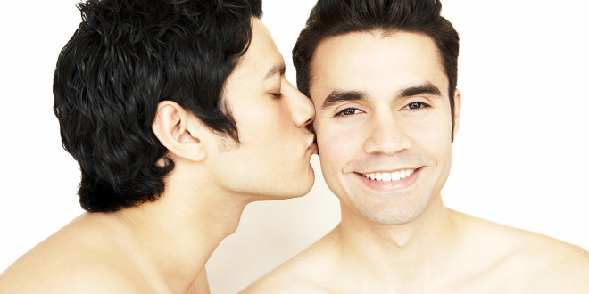 Shirtless gay couple kissing